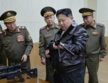 Rifle in hand, Kim Jong Un calls for more powerful North Korean weapons